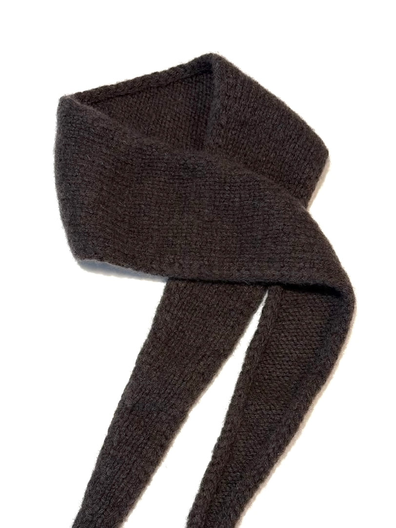A dark brown knit scarf, folded and draped on a plain white background.